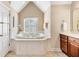 Bathroom featuring soaking tub, double vanity, neutral colors and ample natural light at 1124 Clearspring Dr, Charleston, SC 29412