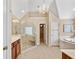Bathroom boasts large glass shower, chandelier, double vanity, and separate soaking tub at 1124 Clearspring Dr, Charleston, SC 29412