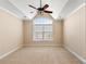 Bedroom featuring a ceiling fan, carpeted floors, neutral paint and an arched window for lots of natural light at 1124 Clearspring Dr, Charleston, SC 29412