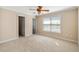 Cozy bedroom with a ceiling fan, neutral walls, and window, perfect for relaxation at 1124 Clearspring Dr, Charleston, SC 29412