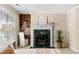 Cozy fireplace with a hearth, built-in shelves, and desk nook area in bedroom at 1124 Clearspring Dr, Charleston, SC 29412