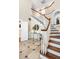 Foyer featuring hardwood stairs with white railing and decorative tile flooring at 1124 Clearspring Dr, Charleston, SC 29412