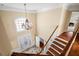 The foyer featuring hardwood stairs, a decorative chandelier, and tile flooring at 1124 Clearspring Dr, Charleston, SC 29412