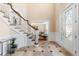 Foyer with marble floors, staircase, and chandelier at 1124 Clearspring Dr, Charleston, SC 29412