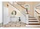 Entryway with marble floors, staircase, and arched doorway at 1124 Clearspring Dr, Charleston, SC 29412