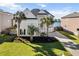 Inviting two-story home with well-manicured lawn and palm trees, located in a tranquil neighborhood at 1124 Clearspring Dr, Charleston, SC 29412