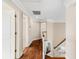 Hallway with hardwood floors and neutral paint, leading to bedrooms at 1124 Clearspring Dr, Charleston, SC 29412