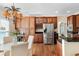 Spacious eat-in kitchen with stainless steel refrigerator, custom cabinets and wine storage at 1124 Clearspring Dr, Charleston, SC 29412