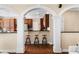 Gourmet eat-in kitchen featuring counter seating and archway to living area at 1124 Clearspring Dr, Charleston, SC 29412