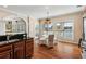 An open, inviting eat-in kitchen with a stainless steel sink and hardwood floors at 1124 Clearspring Dr, Charleston, SC 29412