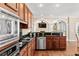 Well-equipped kitchen with stainless steel appliances and rich wooden cabinetry, ideal for cooking at 1124 Clearspring Dr, Charleston, SC 29412