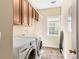 Laundry room featuring a washer and dryer and wood cabinets for storage at 1124 Clearspring Dr, Charleston, SC 29412