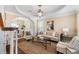 Cozy living room with decorative ceiling, plush seating, and stylish decor with dining area views at 1124 Clearspring Dr, Charleston, SC 29412