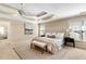 The main bedroom featuring a ceiling fan, tray ceiling, carpeted floors and a decorative rug at 1124 Clearspring Dr, Charleston, SC 29412