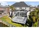 A house exterior with a screened-in porch and backyard deck, with water views at 1124 Clearspring Dr, Charleston, SC 29412