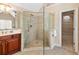 Large glass shower with built in seat in bathroom with double vanity and chandelier at 1124 Clearspring Dr, Charleston, SC 29412