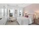 Comfortable bedroom featuring white bedding, stylish wallpaper and bright windows at 114 Snow St, Summerville, SC 29486