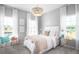 Inviting bedroom with soft lighting, a decorative chandelier, and coordinated furnishings at 114 Snow St, Summerville, SC 29486