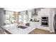 Bright kitchen featuring stainless steel appliances, a modern island and eat-in dining area at 114 Snow St, Summerville, SC 29486