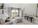 Bright living room featuring a comfortable sofa, natural light, and stylish decor at 114 Snow St, Summerville, SC 29486