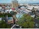 Aerial view of historic townhomes with the Ravenel Bridge and harbor in the background at 12 Elliott St # A, Charleston, SC 29401
