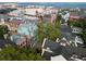 Aerial view of colorful Charleston homes with trees casting shadows onto rooftops at 12 Elliott St # A, Charleston, SC 29401