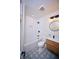 Clean bathroom featuring modern fixtures, updated tile and vanity, and great lighting at 12 Elliott St # A, Charleston, SC 29401