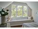 Bright bedroom featuring a window seat, decorative pillows, and natural light at 12 Elliott St # A, Charleston, SC 29401