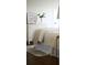 Soft bedroom features hardwood floors, a decorative dresser, and a comfortable bed with decorative pillows at 12 Elliott St # A, Charleston, SC 29401