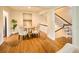 Bright dining area with hardwood floors, a round table, and easy access to the staircase at 12 Elliott St # A, Charleston, SC 29401