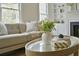 Living room with decorative fireplace, built-in shelving, and lots of natural light at 12 Elliott St # A, Charleston, SC 29401