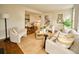Spacious living area with comfortable seating, hardwood floors, and ample space for entertaining guests at 12 Elliott St # A, Charleston, SC 29401