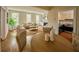 Open-concept living room with views of kitchen and dining area, filled with natural light from many windows at 12 Elliott St # A, Charleston, SC 29401