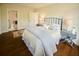 Comfortable bedroom with a walk-in closet, natural light, and access to a private bathroom at 12 Elliott St # A, Charleston, SC 29401