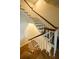 Elegant staircase featuring dark wood steps, white risers, and a classic banister design at 12 Elliott St # A, Charleston, SC 29401