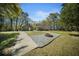 Backyard with an outbuilding and a fire pit area surrounded by gravel, great for outdoor gatherings at 1212 Pinopolis Rd, Moncks Corner, SC 29461