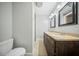 Bathroom featuring a double vanity with dark wood cabinets and a tiled floor at 1212 Pinopolis Rd, Moncks Corner, SC 29461