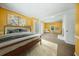 Spacious bedroom with a bed, fireplace, walkout, and natural light streaming in at 1212 Pinopolis Rd, Moncks Corner, SC 29461