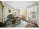 Bright bedroom with a window view, stylish furniture, and calming neutral color palette at 1212 Pinopolis Rd, Moncks Corner, SC 29461