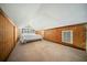 Bedroom with angled ceiling, wood paneling, and carpet flooring at 1212 Pinopolis Rd, Moncks Corner, SC 29461