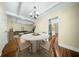 Bright dining area featuring hardwood floors, a round table with chairs, and a view to a living area at 1212 Pinopolis Rd, Moncks Corner, SC 29461