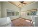 Sunroom styled laundry room with brick floors, bamboo shades, and plenty of natural light at 1212 Pinopolis Rd, Moncks Corner, SC 29461
