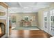 Bright living room with fireplace, hardwood floors, neutral walls and coffered ceilings at 1212 Pinopolis Rd, Moncks Corner, SC 29461