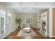 Comfortable living room with hardwood floors, fireplace, and lots of natural light at 1212 Pinopolis Rd, Moncks Corner, SC 29461