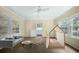 Bright living room with ceiling fan, large windows, sofa, and tent for  at 1212 Pinopolis Rd, Moncks Corner, SC 29461