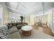 Open concept living room with hardwood floors, a staircase, and a dining area at 1212 Pinopolis Rd, Moncks Corner, SC 29461