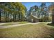 Charming outbuilding with a separate driveway providing additional space and privacy at 1212 Pinopolis Rd, Moncks Corner, SC 29461