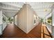 A wraparound porch featuring a wood floor, white ceilings, wood support posts and railings at 1212 Pinopolis Rd, Moncks Corner, SC 29461