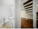 A powder room with a modern sink and toilet, and a partial view of the staircase at 1212 Pinopolis Rd, Moncks Corner, SC 29461