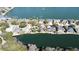 Aerial view of waterfront community showcasing homes with lush green surroundings and clear blue water at 1213 Waterfront Dr, Mount Pleasant, SC 29464